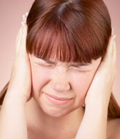 Girl covering her ears.