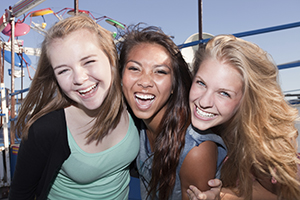 three smiling girls.