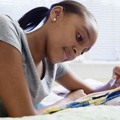 A girl writing in a notebook