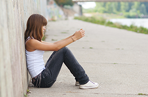 A girl sitting alone.